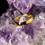 Argolla de matrimonio maciza de 4mm elaborada en oro amarillo de 18k