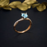 Anillo de compromiso con topacio natural de 1.0ct corte brillante y 18 diamantes naturales laterales elaborado en oro rosa de 14k