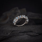 Media churumbela con topacios y 9 diamantes naturales elaborada en oro blanco de 14k