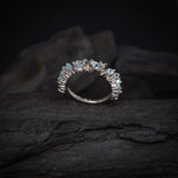 Media churumbela con topacios y 9 diamantes naturales elaborada en oro blanco de 14k