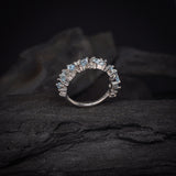 Media churumbela con topacios y 9 diamantes naturales elaborada en oro blanco de 14k