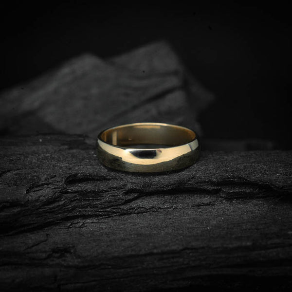 Argolla de matrimonio maciza de 4mm elaborada en oro amarillo de 14k