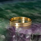 Argolla de matrimonio maciza de 3mm elaborada en oro amarillo y blanco de 14k