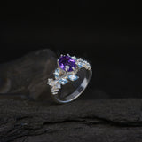 Anillo de compromiso con amatista natural corte oval de 1.0ct y topacios naturales laterales elaborado en oro blanco de 14k